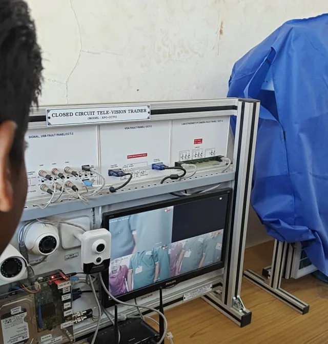 Candidate assessed on a CCTV and electronics trainer panel