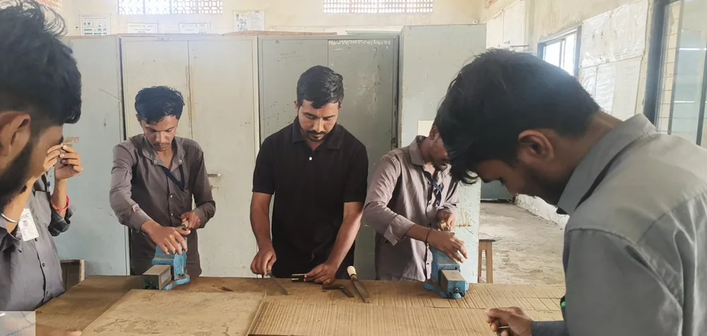 Candidates at a fitter bench-work practical skill assessment